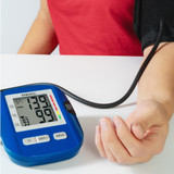 Person using Homedics Upper Arm Blood Pressure Monitor to measure their blood pressure