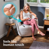 Woman relaxes on the Homedics Shiatsu + Kneading and Vibration Massage Cushion with Heat on chair