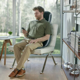 Man sits in chair and enjoys massage from the Homedics Shiatsu 3D TruTouch Massage Cushion