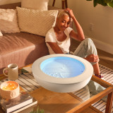 White Wash | a woman looks into the drift 21" with the drift 21" wood ring and practices mindfulness