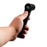 Black | Hand holds the black Homedics Infrared Ear and Forehead Thermometer in black