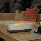 Khaki | Homedics® Fireside Ultrasonic Humidifier with Sound sits on the coffee table as a center piece while releasing mist into the air